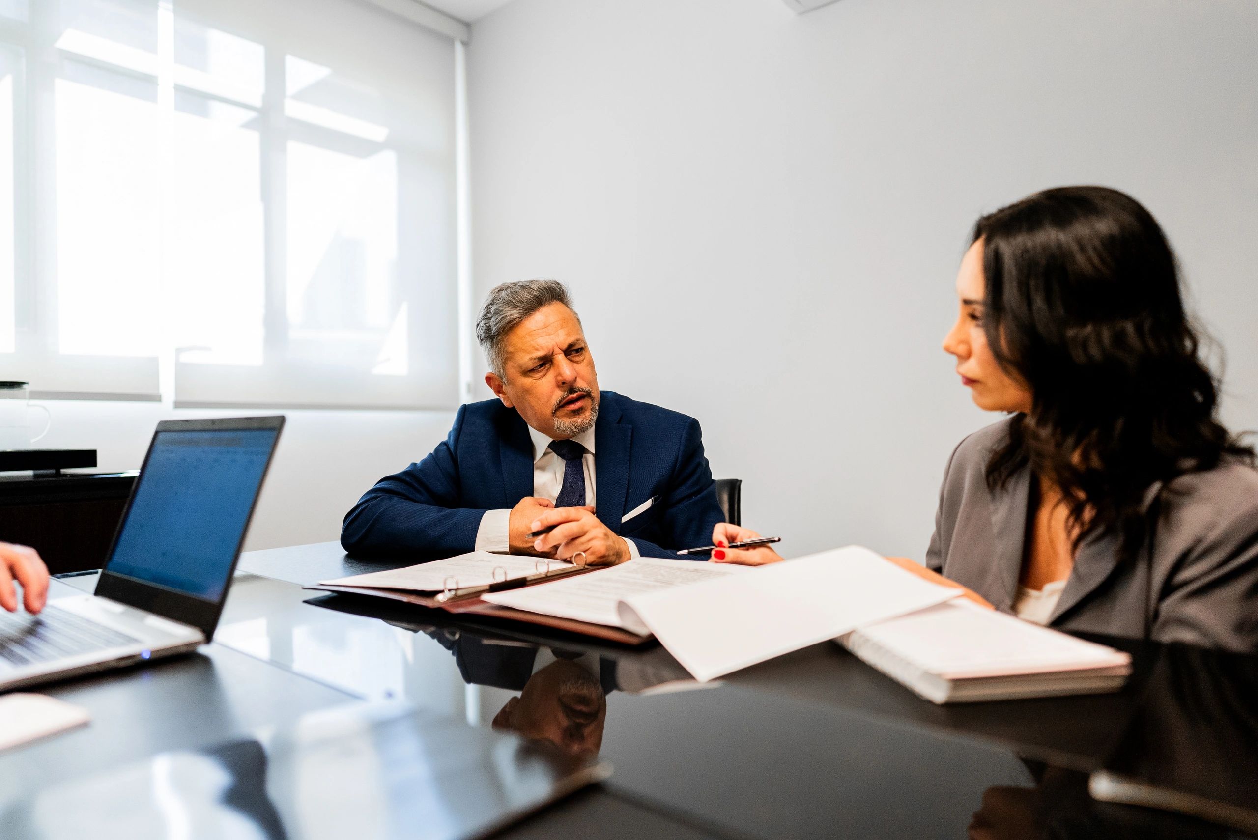 Professionals discussing a case in an office